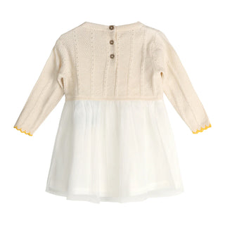Cream-colored dress with long sleeves and yellow trim on a white background