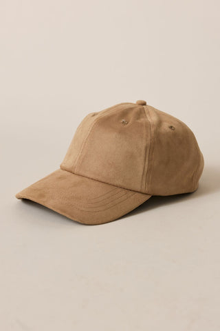 Brown baseball cap on a beige background
