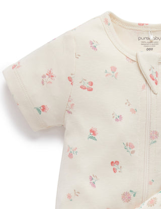 Baby romper with floral pattern on a white background