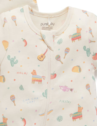 Baby onesie with colorful fiesta-themed print on a light background