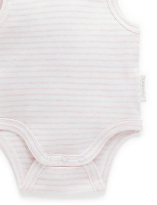 Close-up of a light pink baby bodysuit on a white background
