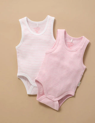 Two baby bodysuits, one striped and one solid pink, on a beige background.