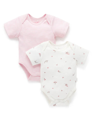 Two baby bodysuits, one pink and one with a bird pattern on a white background