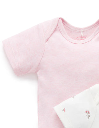 Pink baby onesie on a white background