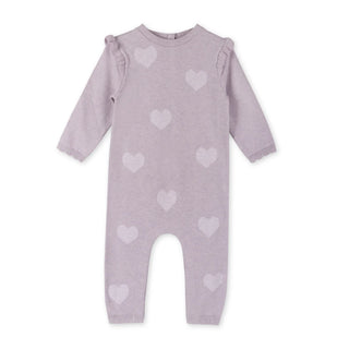 Purple baby romper with heart patterns on a white background