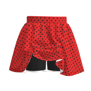 Red boxing shorts with black polka dots on a white background