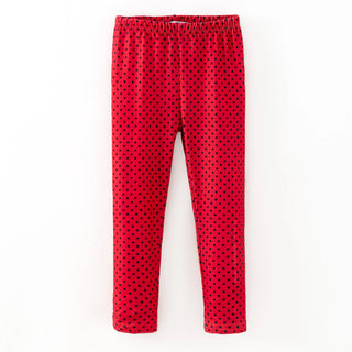 Red polka dot pants on a white background