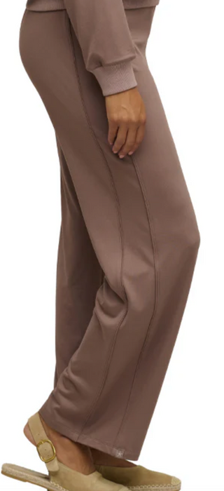 Brown outfit with pants and a top on a white background