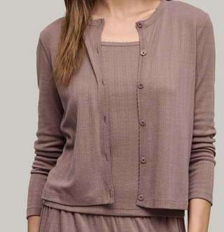 Brown textured cardigan worn by a person on a plain background