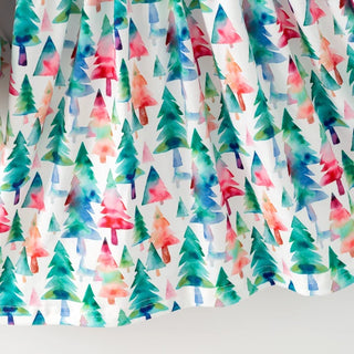 White curtain panel with a colorful watercolor pine tree pattern in shades of green, blue, pink, and red.