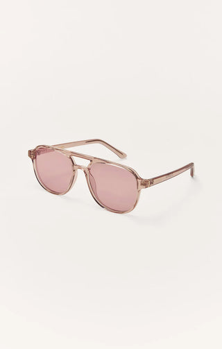 Pink sunglasses with gold frame on a white background