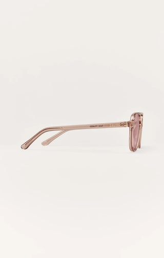 Sunglasses with a thin rose gold frame on a white background