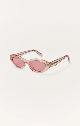 Sunglasses with a cat-eye design and pink lenses on a white background
