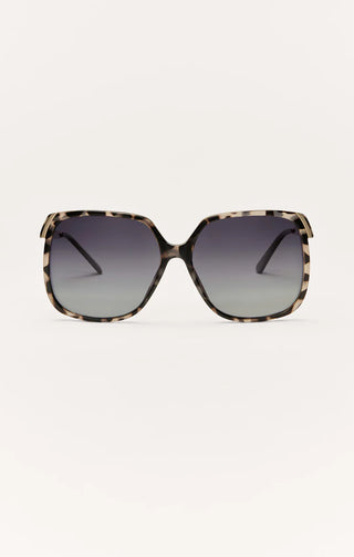 Sunglasses with a tortoiseshell frame on a white background
