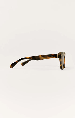 Sunglasses with tortoiseshell frame on a white background