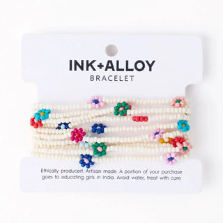 Ink+Alloy bracelet with colorful beads on a white background
