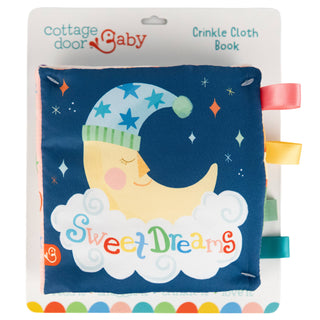 Cottage Door Baby crinkle cloth book with a sleeping moon design on a blue background.
