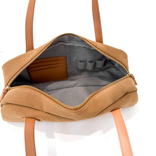 Brown bag with open front compartment on a white background
