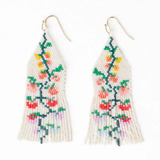 Beaded earrings with floral design on a white background