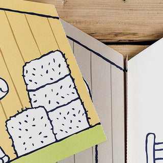 Close-up of a cartoonish drawing of a cactus on a wooden surface