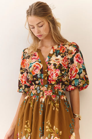 Woman wearing a floral dress with a plain background