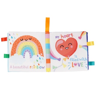 Children's soft book with rainbow and heart illustrations on a white background