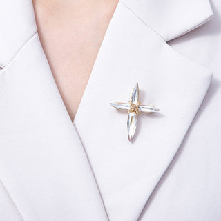Star-shaped brooch on a white shirt