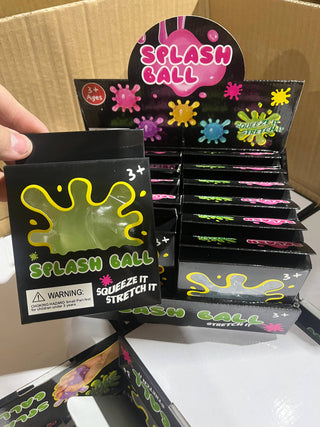 Display of 'Splash Ball' packaging with colorful splashes on a cardboard background