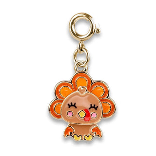 A small orange and yellow cartoon turkey charm with a gold-tone clasp, shown on a plain white background.