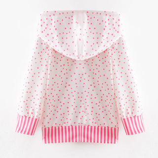 Clear raincoat with pink polka dots and stripes on a white background