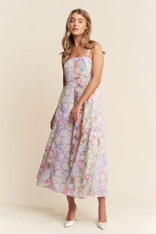 Woman wearing a floral dress on a beige background