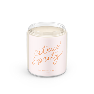 Candle in a glass jar with 'citrus sprity' text on a white background