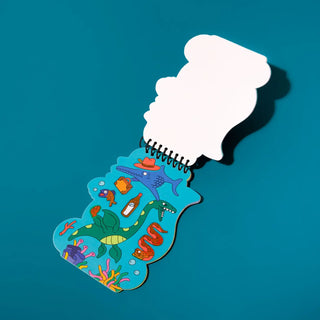 Notebook with underwater-themed cover on a blue background