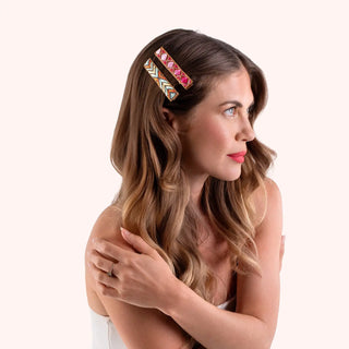 Woman wearing a colorful hair clip on a white background