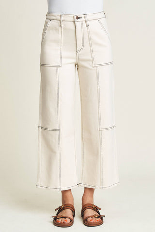 Relaxed fit,  high rise that hits at the ankle. Detailed with front patch pockets. Ecru wash.