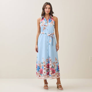 Woman wearing a floral dress with a light blue background