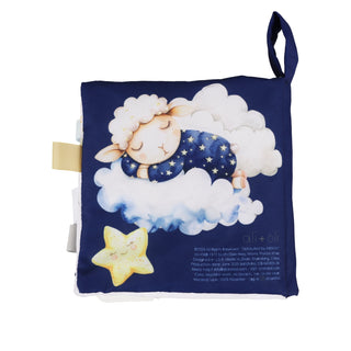 Children's soft book with a sleeping sheep illustration on a blue background