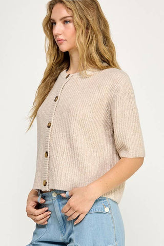 Beige button up the front sweater. 1/2 sleeve.