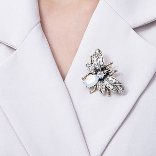 Decorative brooch on a white blazer