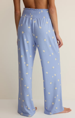 Light blue pants with a subtle pattern worn by a person on a neutral background