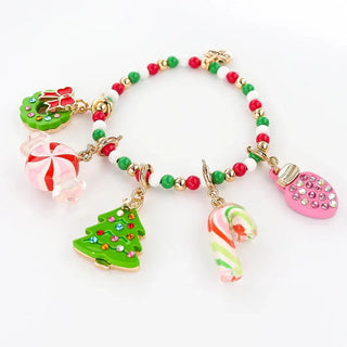 Colorful beaded bracelet with Christmas-themed charms on a white background