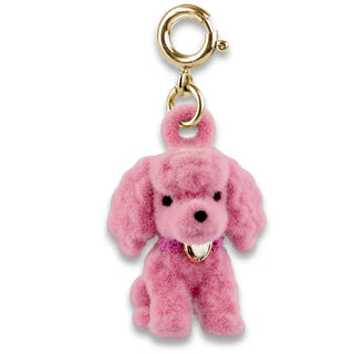 Pink plush dog charm with gold accents on a white background