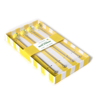 Set of dental syringes in a yellow and white box on a white background