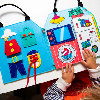 Children's educational board book with interactive elements on a white surface.