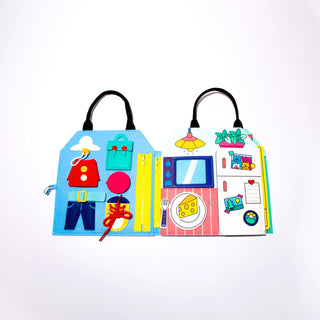 Colorful children's book with illustrations of a house, car, and other objects on a white background