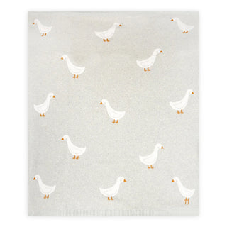 Baby blanket with pattern of white ducks on a textured gray background