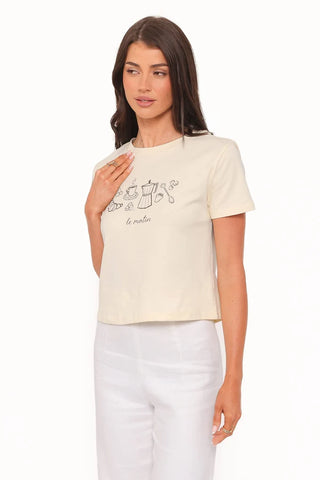 Woman wearing a white t-shirt with a graphic design on a white background