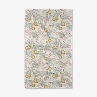 Floral patterned rug with flowers and leaves on a light background
