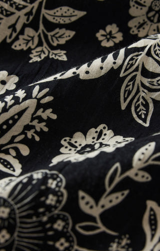 Close-up of black fabric with white floral pattern