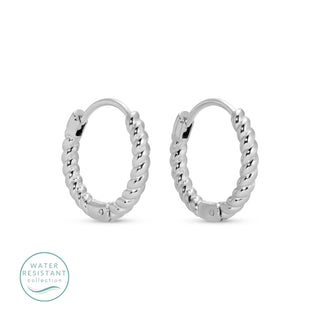 Pair of silver hoop earrings on a white background with 'Water Resistant' collection label.